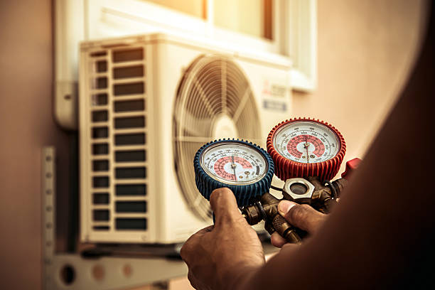 Professional Air Conditioning Service technician working in Como, TN